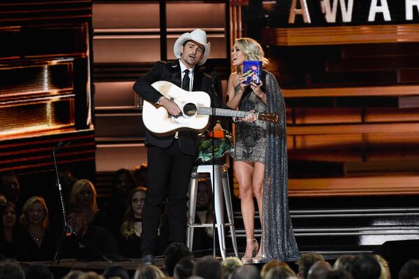 Brad Paisley and Carrie Underwood tried to keep the mood light. (Photo by Gustavo Caballero/Getty Images)