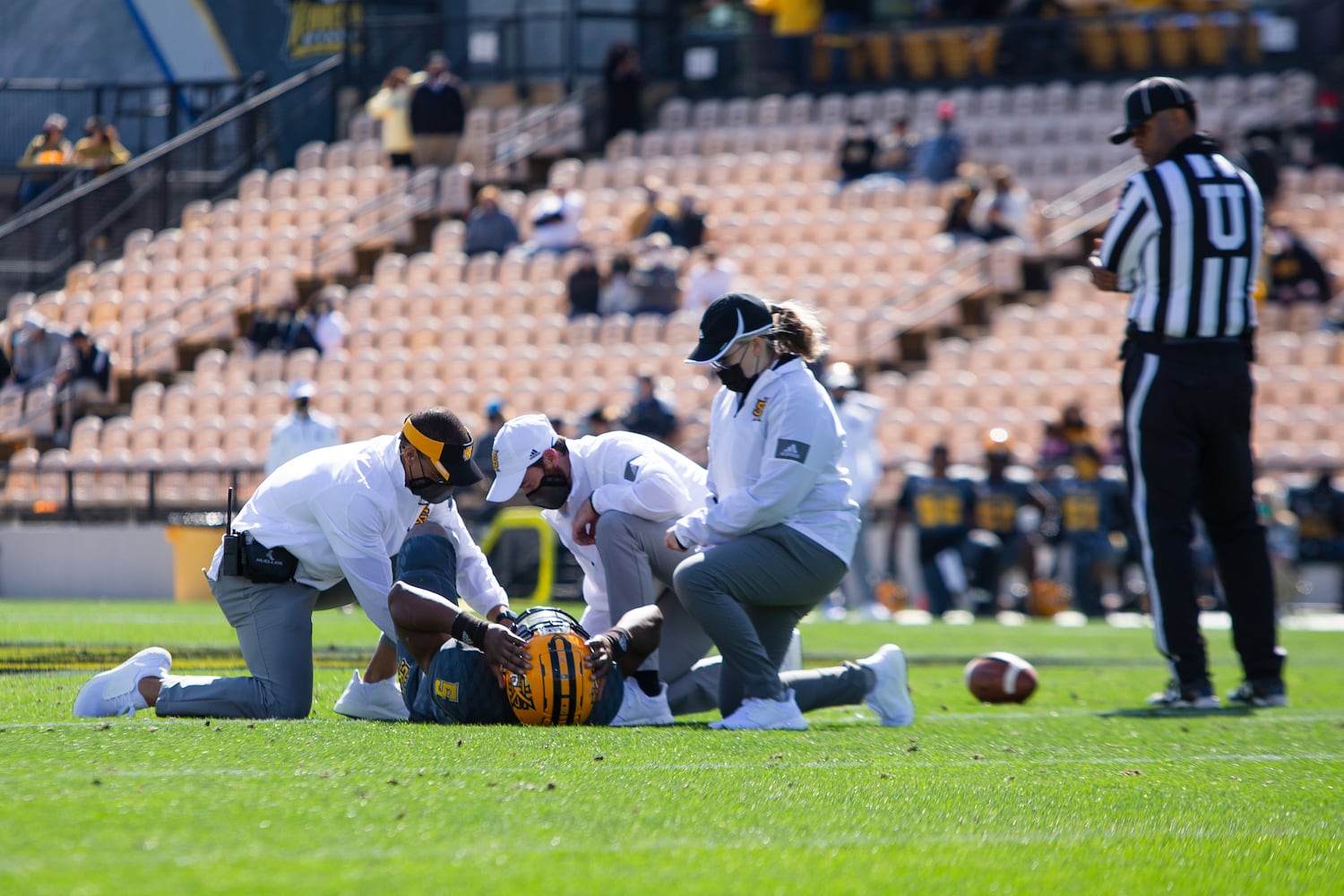 Tommy Bryant of Kennesaw State gets help after an injury. CHRISTINA MATACOTTA FOR THE ATLANTA JOURNAL-CONSTITUTION.