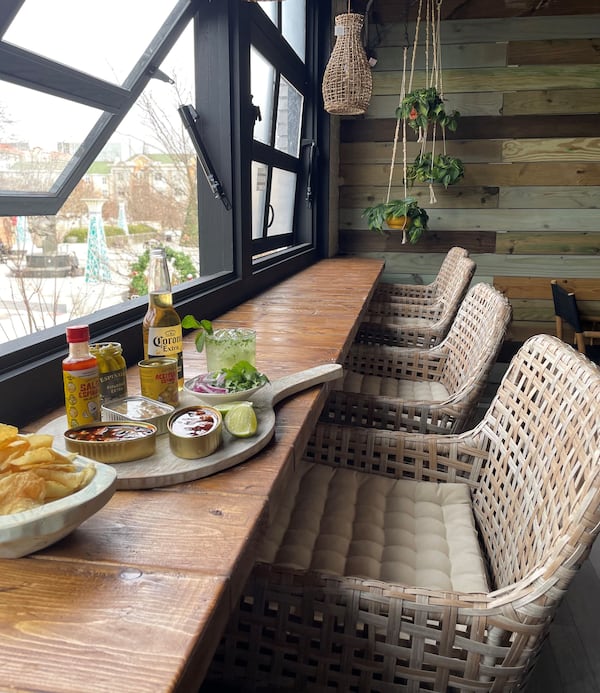 Counter seating on the third level of Boho115 offers a view of Decatur Square. Courtesy of Rebecca Carmen