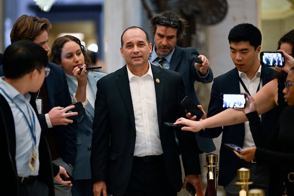 Rep. Bob Good, R-Va., talks with reporters after attending a meeting with Speaker of the House Mike Johnson, R-La., as the House works on a spending bill to avert a shutdown of the Federal Government, Friday, Dec. 20, 2024, at the Capitol in Washington. (AP Photo/John McDonnell)