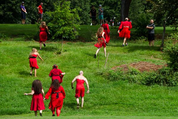 Kate Bush fans "running up that hill" after a group dance performance to celebrate the seventh annual international "Most Wuthering Heights Day Ever," on Saturday, July 30, 2022, in Candler Park in Atlanta. The event celebrates Kate Bush's 1978 song "Wuthering Heights" with events in more than 40 cities around the world. CHRISTINA MATACOTTA FOR THE ATLANTA JOURNAL-CONSTITUTION