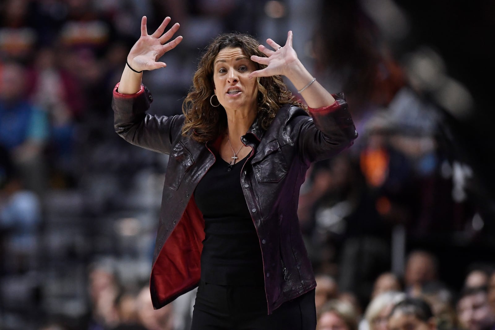 Connecticut Sun head coach Stephanie White gestures during the second half of Game 4 in the WNBA basketball semifinals against the Minnesota Lynx, Sunday, Oct. 6, 2024, in Uncasville, Conn. (AP Photo/Jessica Hill)