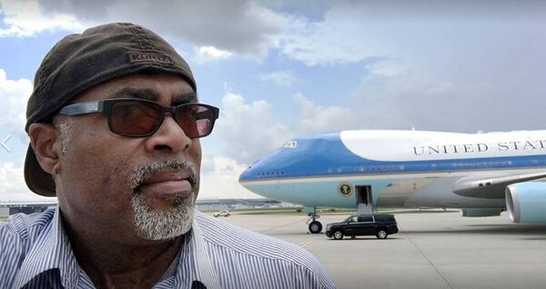 Kent Johnson, who photographed presidents, governors, movie stars and quarterbacks, as well as ordinary Atlantans, standing in front of Air Force One after the president’s plane landed in Atlanta.