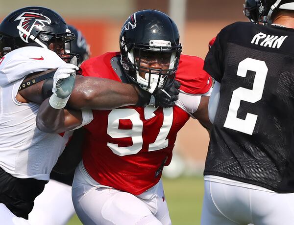 Atlanta Falcons defensive tackle Grady Jarrett (97) applies a little token heat to quarterback Matt Ryan in preseason camp.