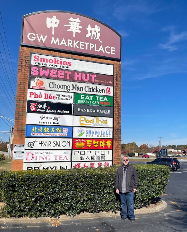 State Rep. Pedro Marin stands outside a mall on Pleasant Hill Road in Gwinnett County that has benefited from the influx of new residents, and dollars, coming to the county. (Photo by Bill Torpy)