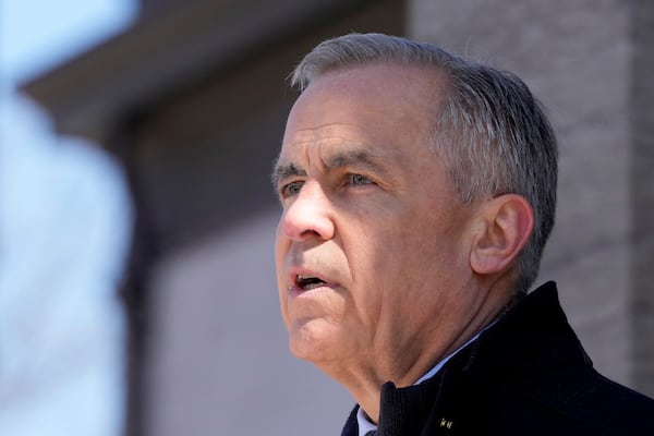 Canada Prime Minister Mark Carney speaks to media at Rideau Hall, where he asked the Governor General to dissolve Parliament and call an election, in Ottawa, Sunday, March 23, 2025. (Frank Gunn/The Canadian Press via AP)