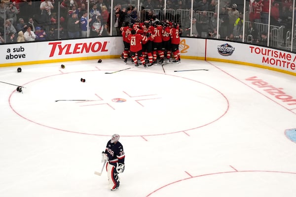 United States goaltender Connor Hellebuyck (37) skates away after an overtime loss to Canada during the 4 Nations Face-Off championship hockey game, Thursday, Feb. 20, 2025, in Boston. (AP Photo/Charles Krupa)