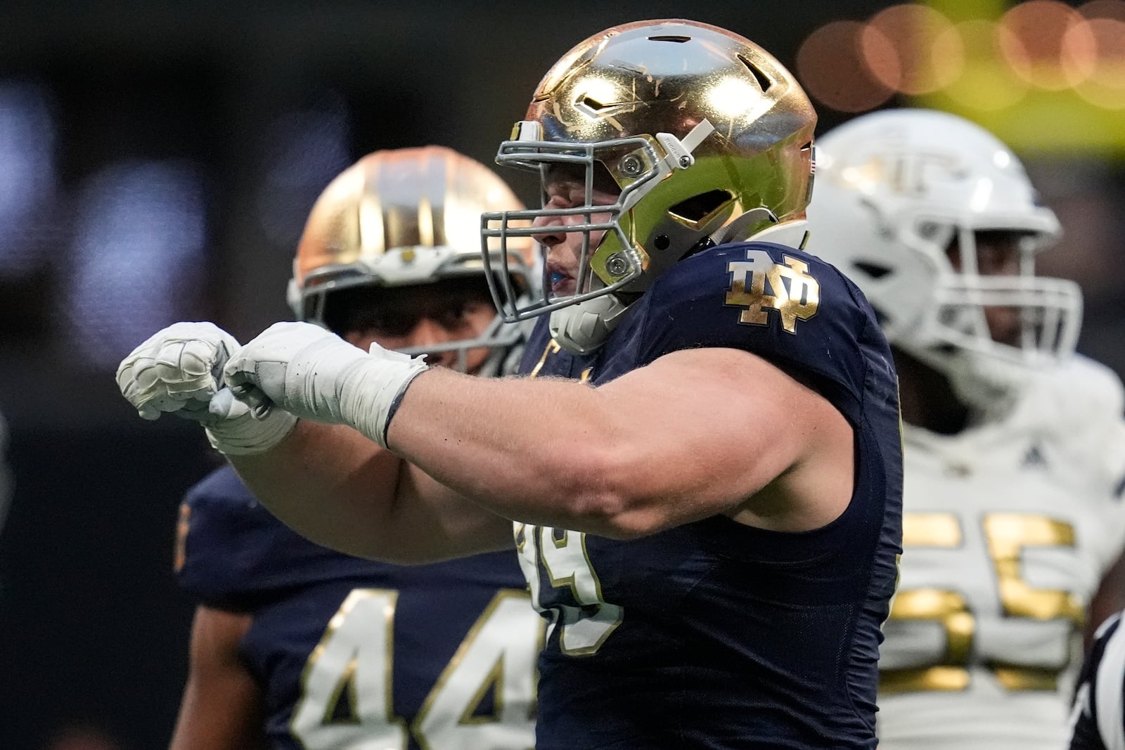 Notre Dame defensive lineman Rylie Mills (99) celebrates a sack of Georgia Tech quarterback Zach Pyron during the second half of an NCAA college football game, Saturday, Oct. 19, 2024, in Atlanta. (AP Photo/Mike Stewart)