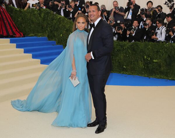 Alex Rodriguez attends the Met Gala with singer Jennifer Lopez (right).