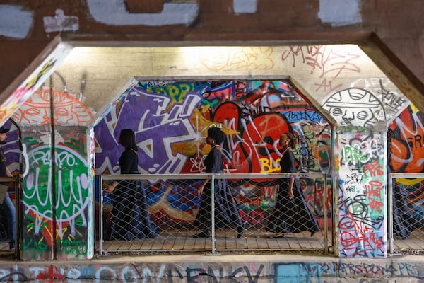 The Spelman Glee Club enters Krog Street Tunnel to perform on Thursday, March 7, 2024. The performance is part of the Creative Placemaking Summit taking place in Atlanta from March 5-8. (Natrice Miller/ Natrice.miller@ajc.com)