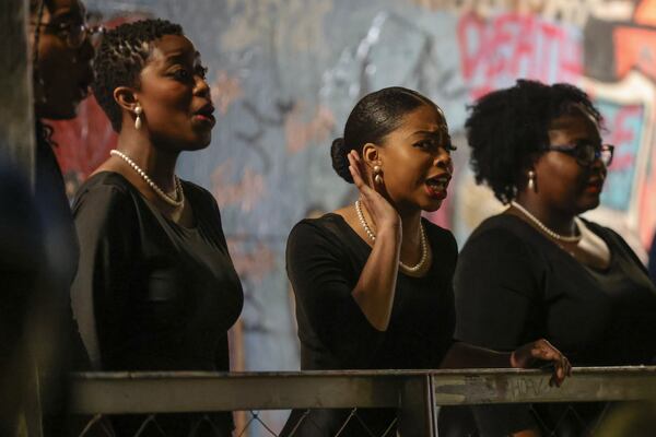 Kerrington Griffin, a senior dance major at Spelman College  sings a solo during a performance with the Spelman Glee Club inside Krog Street Tunnel on Thursday, March 7, 2024. The performance is part of the Creative Placemaking Summit taking place in Atlanta from March 5-8. (Natrice Miller/ Natrice.miller@ajc.com)