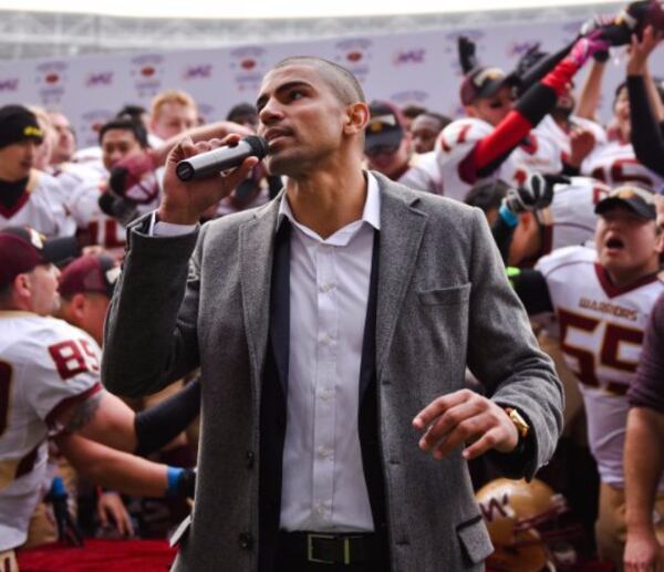 Chris McLaurin addresses Chinese football players.