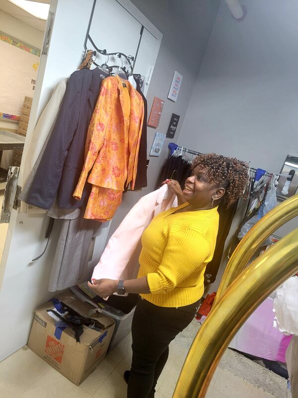 A volunteer at the Omni Hotel's Career Closet readies items for employees. The year-old initiative allows any employee to select items free of charge to help them dress for the job they have or the job they want. (Contributed, Omni Hotel)