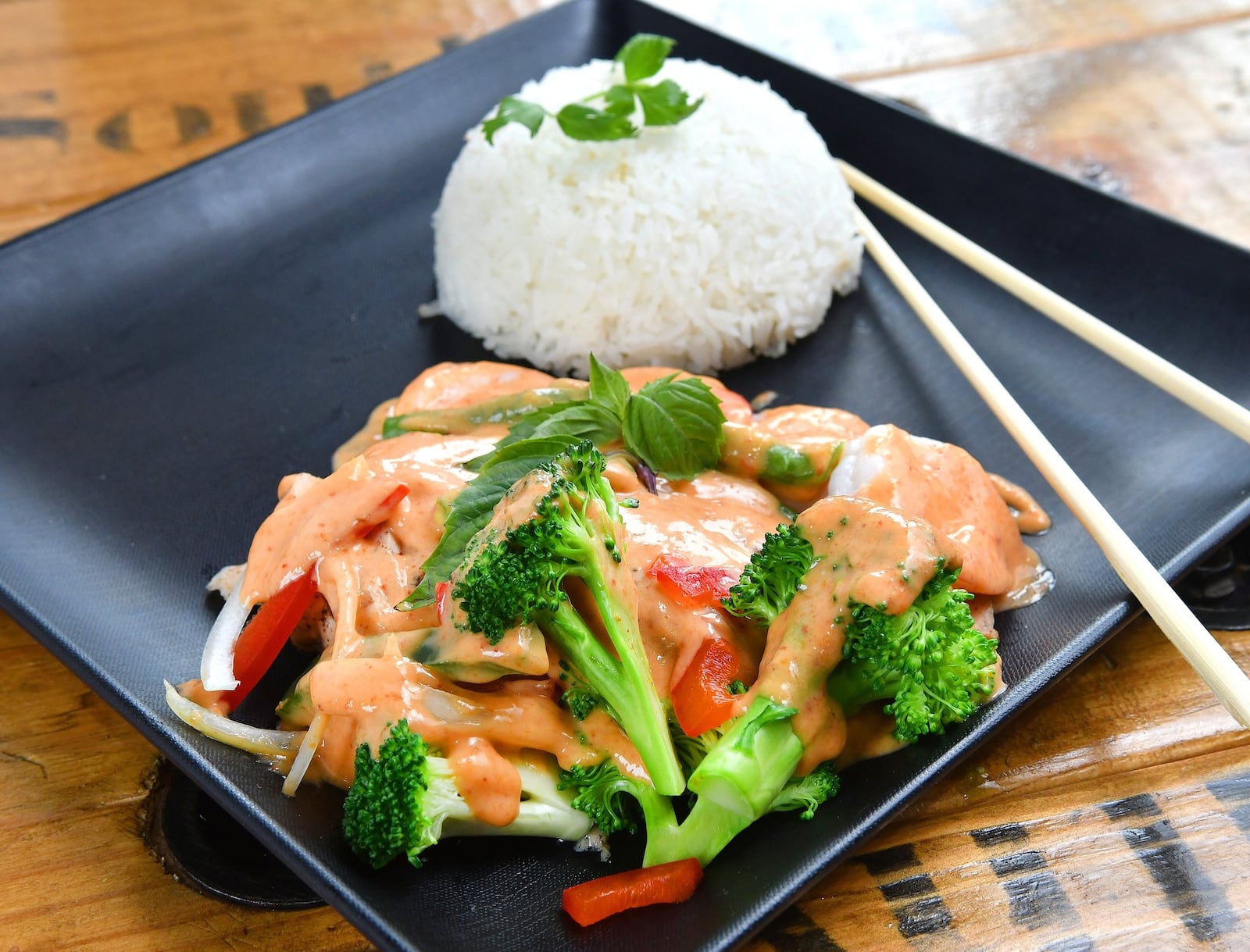 Red Curry Chicken and Shrimp (Thai Food) All-natural local chicken, all-natural shrimp, green beans, bamboo shoot, bell peppers, brocolli, fresh basil, roasted red curry sauce. CONTRIBUTED BY CHRIS HUNT PHOTOGRAPHY