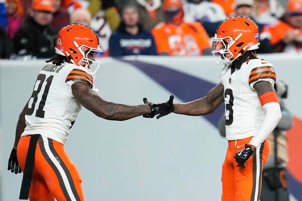 Cleveland Browns wide receiver Jerry Jeudy (3) celebrates his 70-yard pass reception for a touchdown with wide receiver Michael Woods II (81) during the second half of an NFL football game against the Denver Broncos, Monday, Dec. 2, 2024, in Denver. (AP Photo/Jack Dempsey)