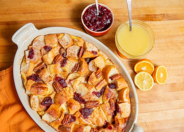 Turn leftover dinner rolls into a delicious bread pudding topped with a sweet, tangy glaze. (Aaliyah Man for The Atlanta Journal-Constitution)