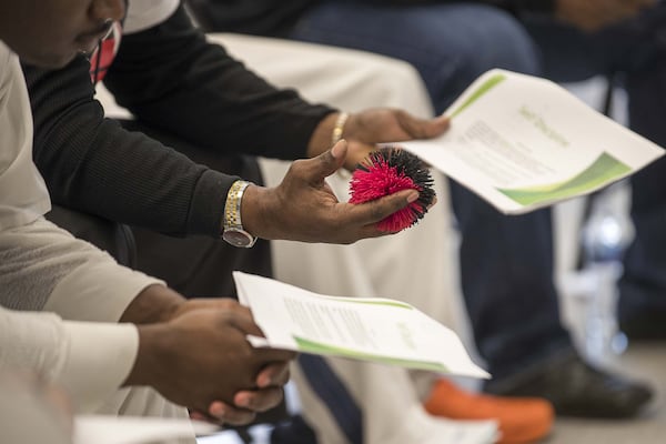 Self-proclaimed gang members read aloud during a Project Safe Neighborhood class, which assists in reform, at the Metro Reentry Facility, part of the Georgia Department of Corrections, in south DeKalb County on March 11, 2020. (Alyssa Pointer/Alyssa.Pointer@AJC.com)