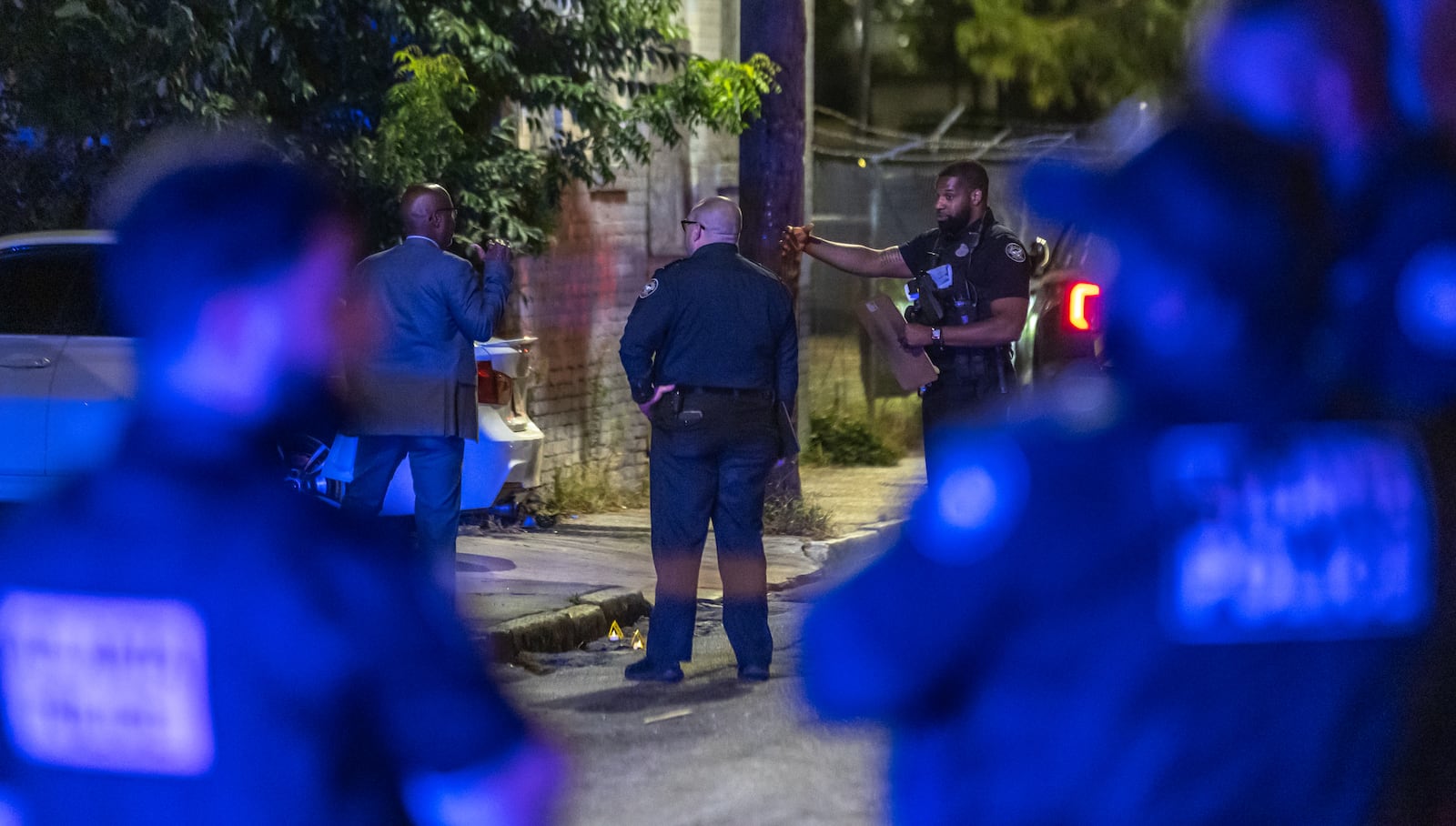 Atlanta police investigators process a crime scene on Wednesday, Sept. 11, 2024. Violent crime has decreased in Atlanta since 2022.  (John Spink/AJC)