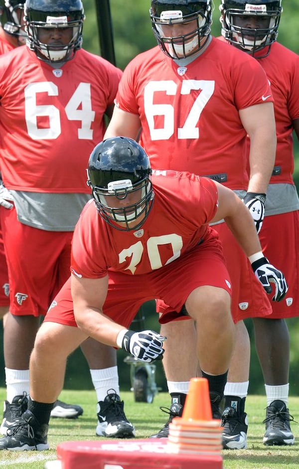 HYOSUB SHIN / AJC May 16, 2014 Flowery Branch - Atlanta Falcons rookie offensive tackle Jake Matthews #70 runs a drill during the first day of Mini-Camp for rookies on Friday, May 16, 2014. HYOSUB SHIN / HSHIN@AJC.COM