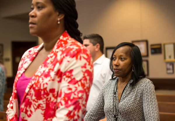 06/26/2018 -- Roswell, GA - Lynnette Allen (right) Fulton County's new opioid coordinator, listens to speakers during an Opioid Crisis Forum at the Roswell City Council Chambers,Tuesday, June 26, 2018. ALYSSA POINTER/ALYSSA.POINTER@AJC.COM