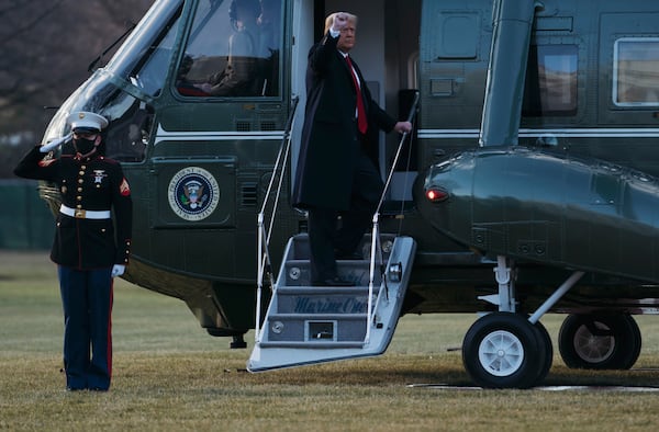 President Donald Trump and first lady Melania Trump board Marine One as they depart the White House on Jan. 20, 2021 in Washington, DC. President Trump is making his scheduled departure from the White House for Florida, several hours ahead of the inauguration ceremony for his successor Joe Biden, making him the first president in more than 150 years to refuse to attend the inauguration. (Eric Thayer/Getty Images/TNS)