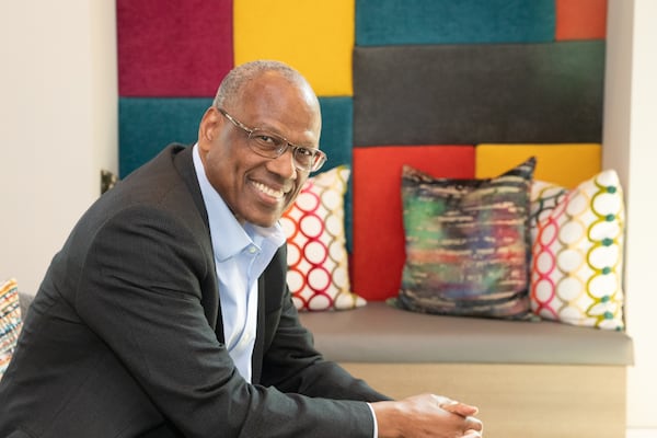 The Integral Group’s CEO and Chairman Egbert Perry, right, is in the lobby of one of several multi-family housing buildings at Scholars Landing along Atlanta Student Movement Boulevard near Clark Atlanta University on Monday, June 5, 2023. The development has multi-family housing, independent senior living units and more lots ready for development soon.  (Jenni Girtman for The Atlanta Journal-Constitution)