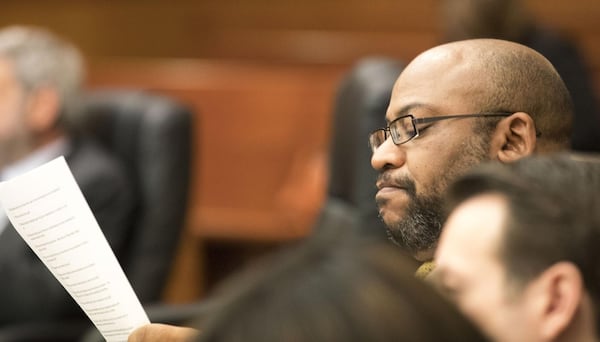 03/05/2018 — Atlanta, GA — Fulton County Chief Assistant District Attorney Clint Rucker reads over notes during the first day of jury selection for the Tex McIver case before Fulton County Chief Judge Robert McBurney on Monday, March 5, 2018. ALYSSA POINTER/ALYSSA.POINTER@AJC.COM