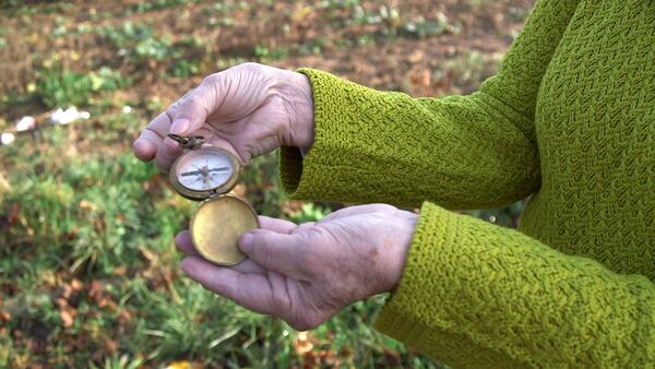 Shirley Sessions, the widow of WWII veteran Eddie Sessions, uses her husband's compass at the first stop of her journey to retrace Eddie's steps during his time in France. Eddie was a soldier in the 95th Infantry, and helped liberate the city of Metz, France in 1944. RYON HORNE/RHORNE@AJC.COM