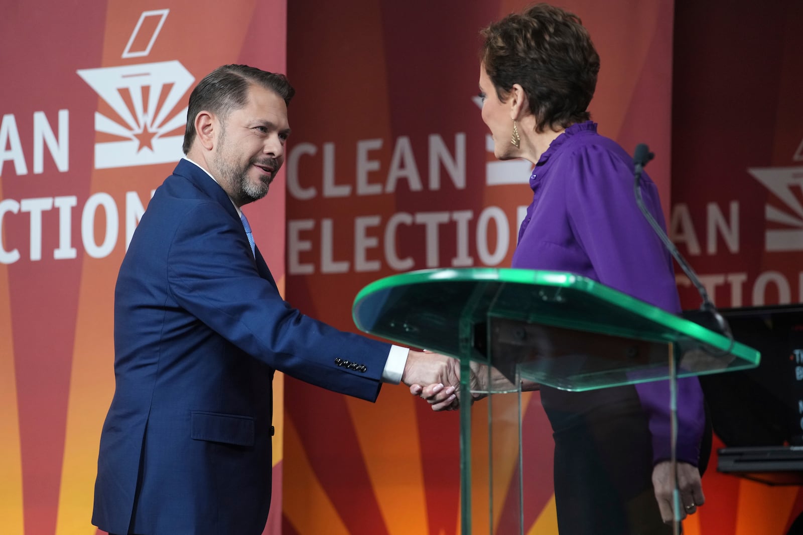 U.S. Senate candidate U.S. Rep. Ruben Gallego, D-Ariz., left, greets Republican challenger Kari Lake prior to their debate, Wednesday, Oct. 9, 2024, in Phoenix. (Joe Rondone/Arizona Republic via AP)