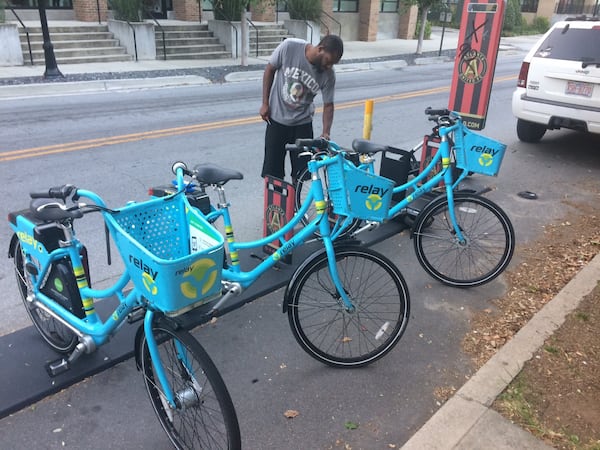 Relay worker Antrel Adams helps keep afloat Atlanta’s fleet of shareable bikes. Photo by Bill Torpy