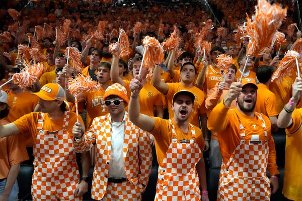 Tennessee fans cheer in the first half of an NCAA college basketball game between Tennessee and Alabama Saturday, March 1, 2025, in Knoxville, Tenn. (AP Photo/Mark Humphrey)