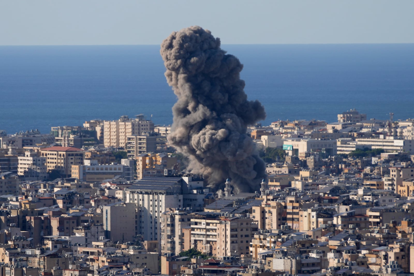 Smoke rises from an Israeli airstrike on Dahiyeh, in the southern suburb of Beirut, Lebanon, Saturday, Oct. 19, 2024. (AP Photo/Hussein Malla)