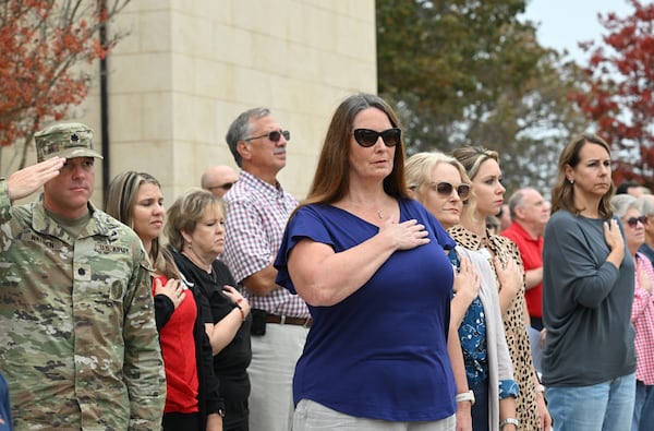 Elinor Carrick (center) attends a Veterans Day Parade at Georgia Military College, Friday, November 10, 2023, in Milledgeville. (Hyosub Shin / Hyosub.Shin@ajc.com)