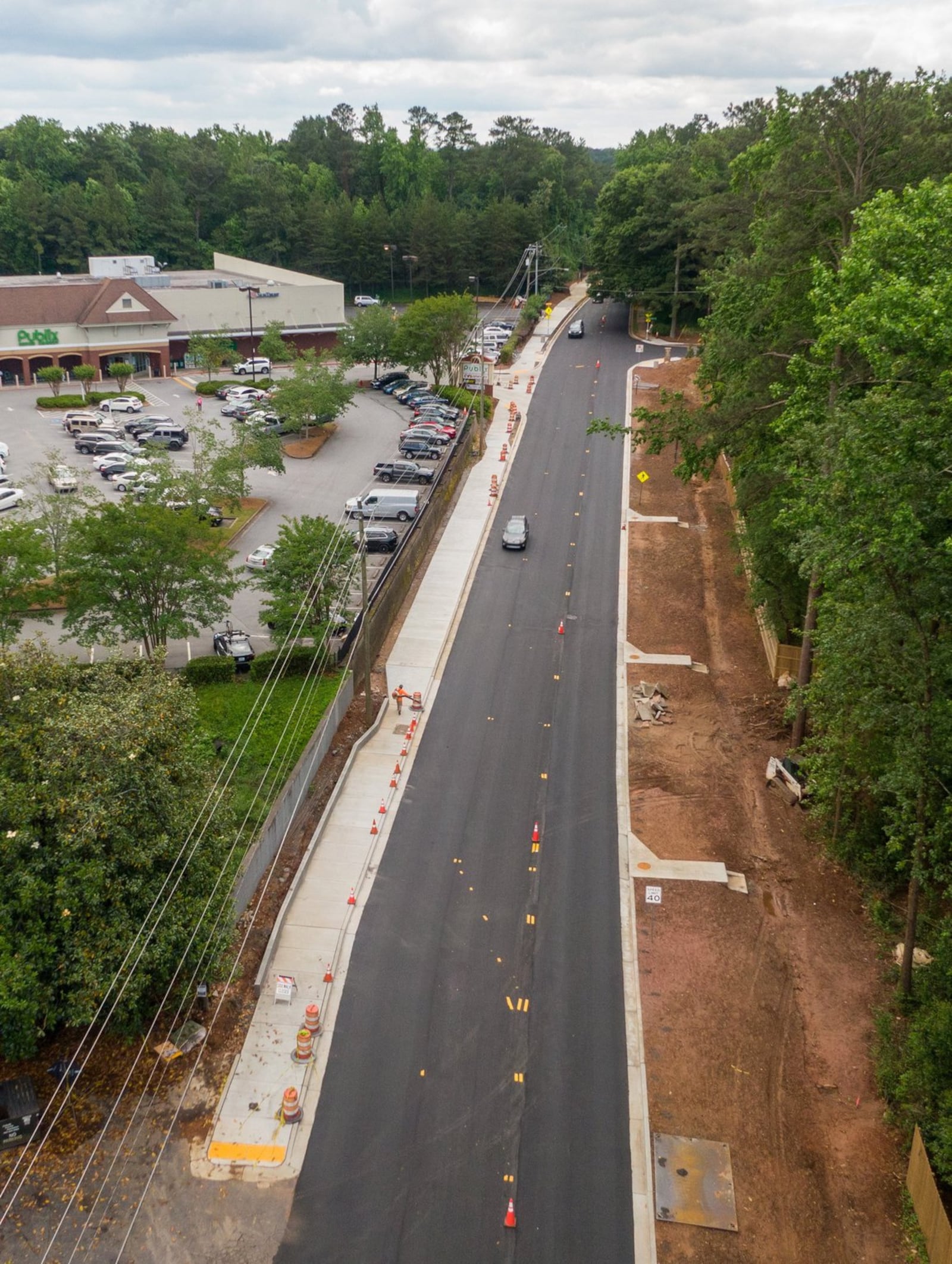 Aerial view of construction of a new multi-use path along the eastern side of Ashford Dunwoody Road near the Publix on Tuesday, May 15, 2020. (Hyosub Shin / Hyosub.Shin@ajc.com)