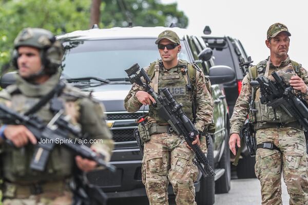 DeKalb County SWAT was called to negotiate with the man after he barricaded himself inside a home on Rock Knoll Drive. JOHN SPINK / JSPINK@AJC.COM