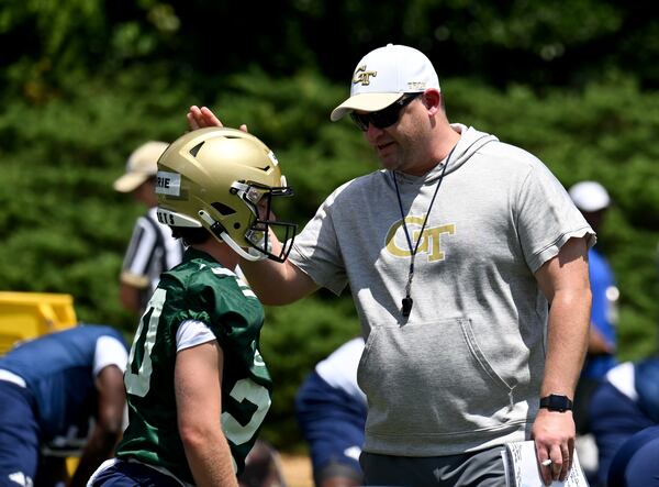 Georgia Tech's head coach Brent Key talks to Georgia Tech's quarter back Ben Guthrie (20) during a training camp at Georgia Tech’s Rose Bowl Field, Tuesday, August 1, 2023, in Atlanta. (Hyosub Shin / Hyosub.Shin@ajc.com)