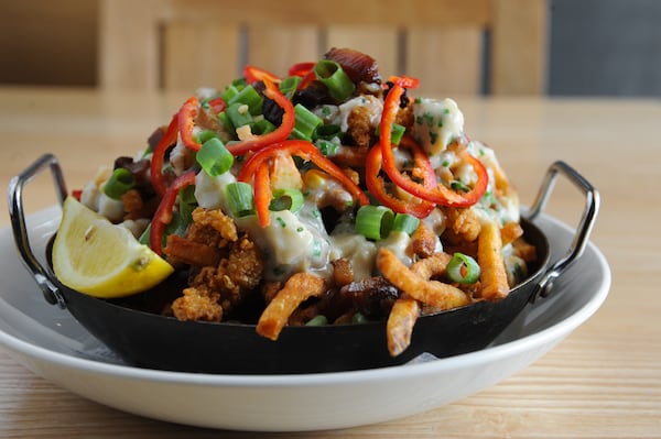 Chowder Fries with Benton's bacon, fried clams and Meyer lemon puree. (BECKY STEIN PHOTOGRAPHY)