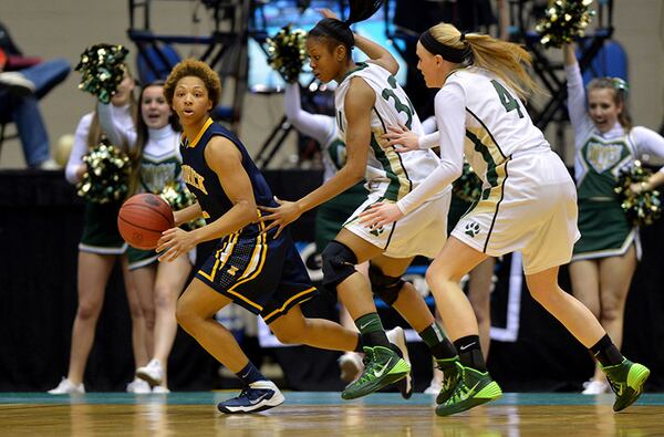 MARCH 6, 2014 MACON Kendrick Cherokees Kahlia Lawrence #2 looks to pass as Wesleyan Wolves Keevana Edwards #33 and Wesleyan Wolves Lauren Frerking #4 come in on defense during action in the first half. Coverage of the Class AA girls basketball championship between Wesleyan Wolves and Kendrick Cherokees at the Macon Coliseum Friday, March 7, 2014. KENT D. JOHNSON / KDJOHNSON@AJC.COM Kahlia Lawrence averaged a team-leading 26.2 points, 7.1 rebounds and six steals in guiding the Cherokees to an undefeated season. (Kent D. Johnson / AJC)