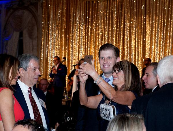 Starr Wren, of North Palm Beach, takes a selfie with guest speaker Eric Trump during A Red, White and Blue Celebration honoring the first anniversary of Donald Trump's inauguration at Mar-a-Lago Club January 18, 2018 in Palm Beach . (Meghan McCarthy/ The Palm Beach Post)