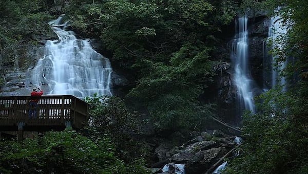 A visitor takes in spectacular Anna Ruby Falls in the heart of the Chattahoochee National Forest.