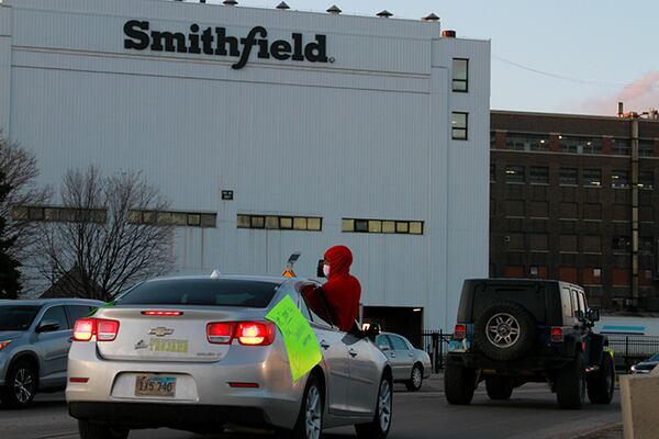 Employees and family members protest outside a Smithfield Foods processing plant in Sioux Falls, S.D. The plant has had an outbreak of coronavirus cases according to Gov. Kristi Noem.