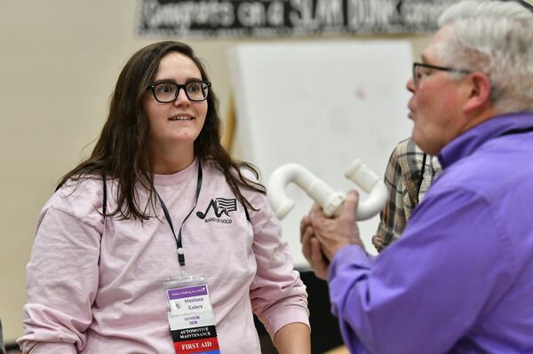 Senior Montana Esters reacts as instructor Jeff Bearinger (foreground) instructs during the second annual Senior Adulting Day at Lumpkin County High School in Dahlonega on Friday, Jan. 24, 2020. Esters already had a head start on several life skills, but she learned a few new things. 