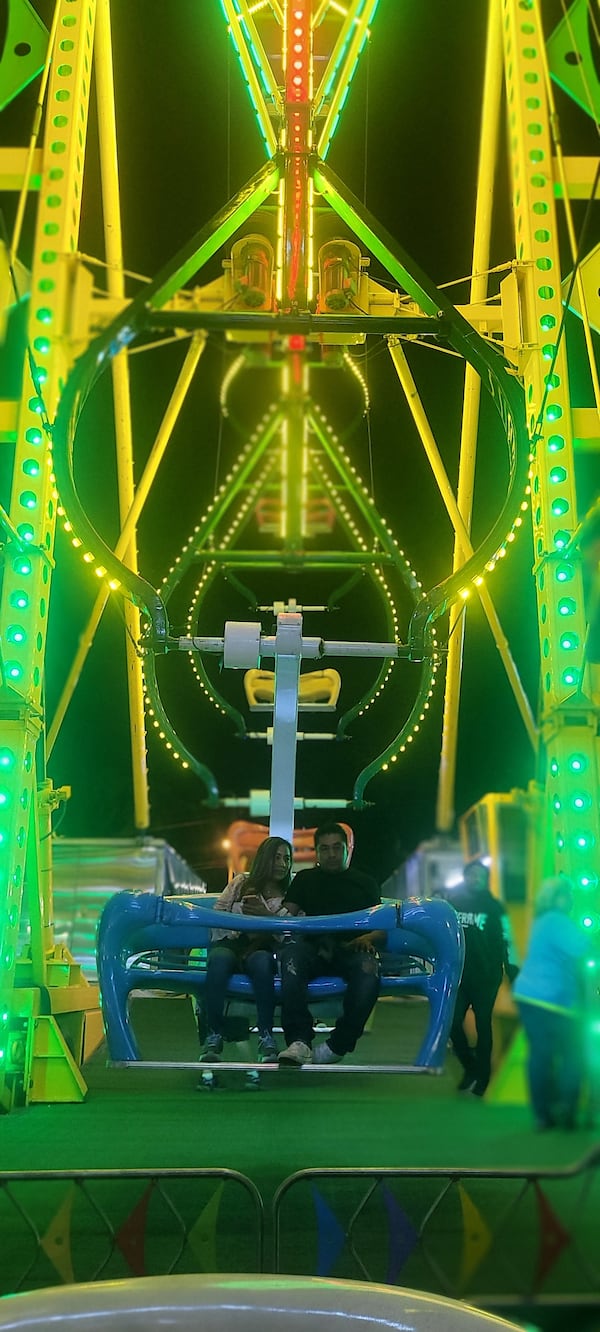 A couple is about to go on a thrill ride at the North Georgia State Fair. 
(Courtesy of Missy Miller.)