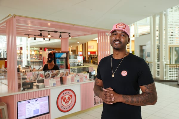 Ludacris’ official DJ Calvin “Infamous” Donald is pictured by the kiosk Panda Pancakes near the food court at the North Point Mall, Thursday, November 7, 2024, in Alpharetta, Ga. Also pictured is Calvin’s wife, Ashanta Donald. (Jason Getz / AJC)
