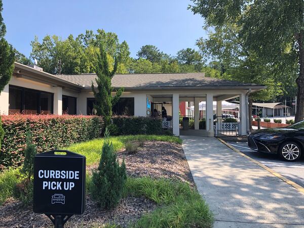 The Colonnade on Cheshire Bridge Road now has designated parking spots for curbside pickup, and is setting up patio seating in the rear. Wendell Brock for The Atlanta Journal-Constitution