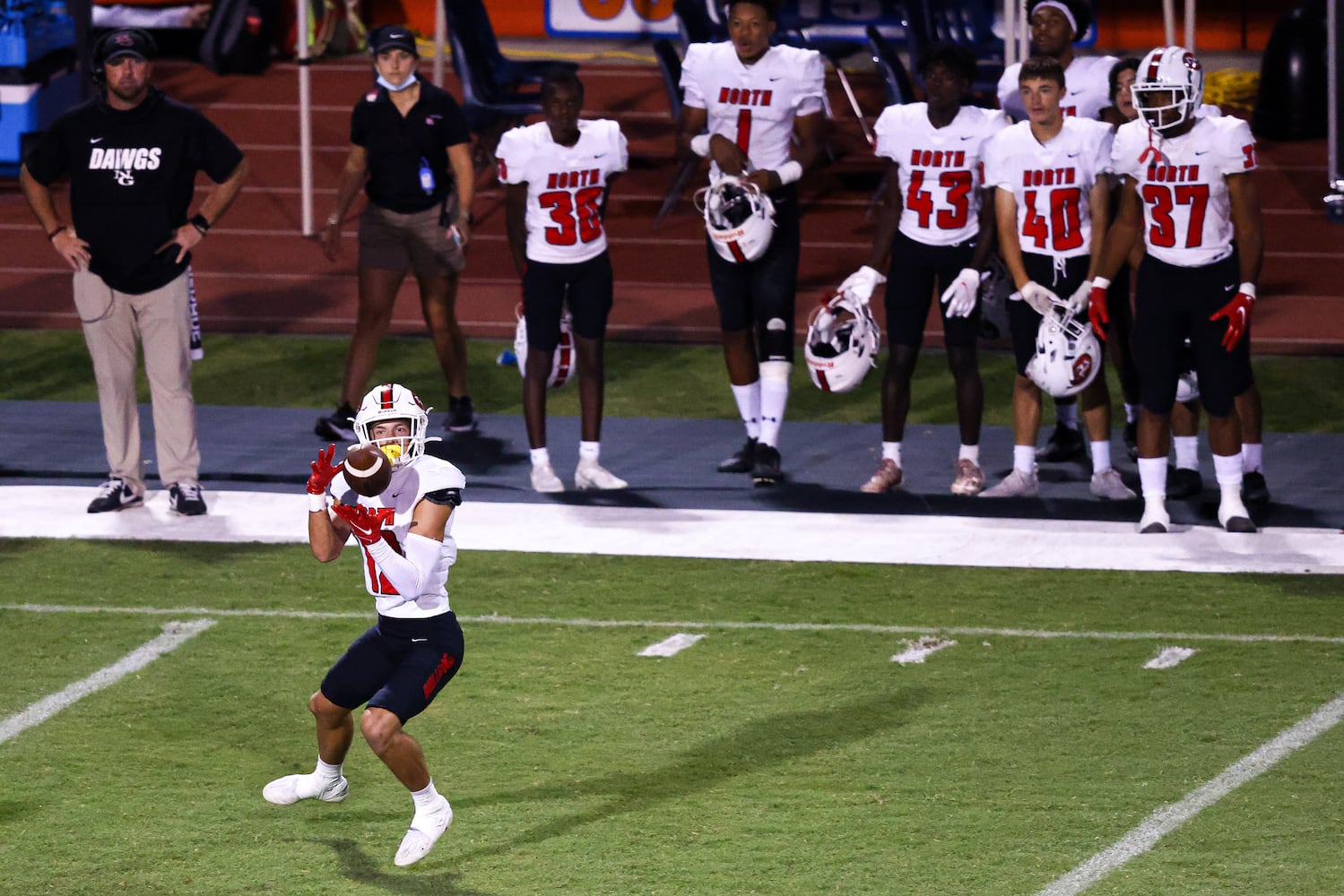 North Gwinnett wide receiver Marek Briley (12) pulls in a pass during a GHSA 7A high school football game between the North Gwinnett Bulldogs and the Parkview Panthers at Parkview High School in Lilburn, Ga., on Friday, Sept. 3, 2021. (Casey Sykes for The Atlanta Journal-Constitution)