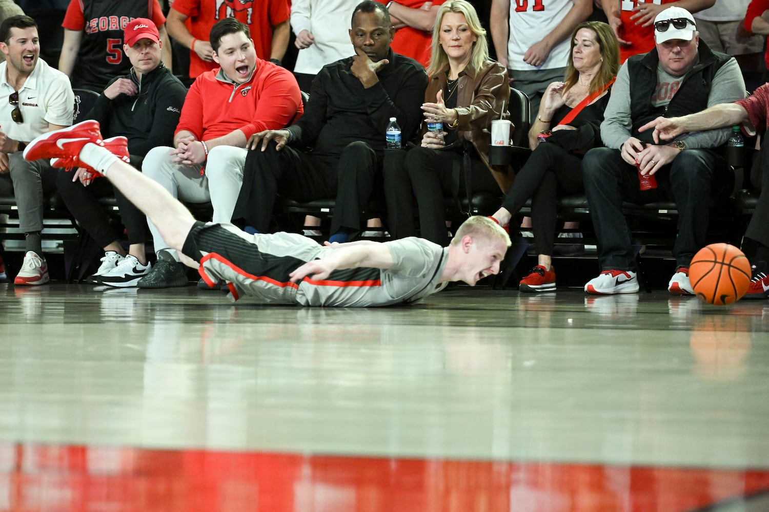 Georgia guard Blue Cain (0) dives after a loose ball during the first half of an NCAA Basketball game Saturday, March 8, 2025 at Stegeman Coliseum in Athens. (Daniel Varnado/For the Atlanta Journal-Constitution)