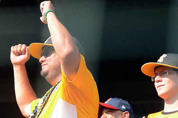 Peachtree City coach Patrick Gloriod celebrates from the stands as Hawaii wins the Little League World Series on Aug. 26, 2018 in Williamsport, Pennsylvania. (Photo: Mitchell Northam, mitchell.northam@coxinc.com, AJC)