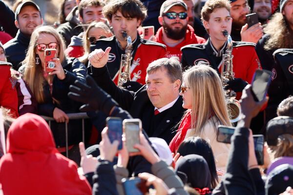 Georgia head coach Kirby Smart gives thumbs up to the fans as he walks through the  Dawg Walk during the victory parade in Athens on Saturday, January 14, 2023. The Bulldogs are the first back-to-back champions in the College Football Playoff era.  Miguel Martinez / miguel.martinezjimenez@ajc.com