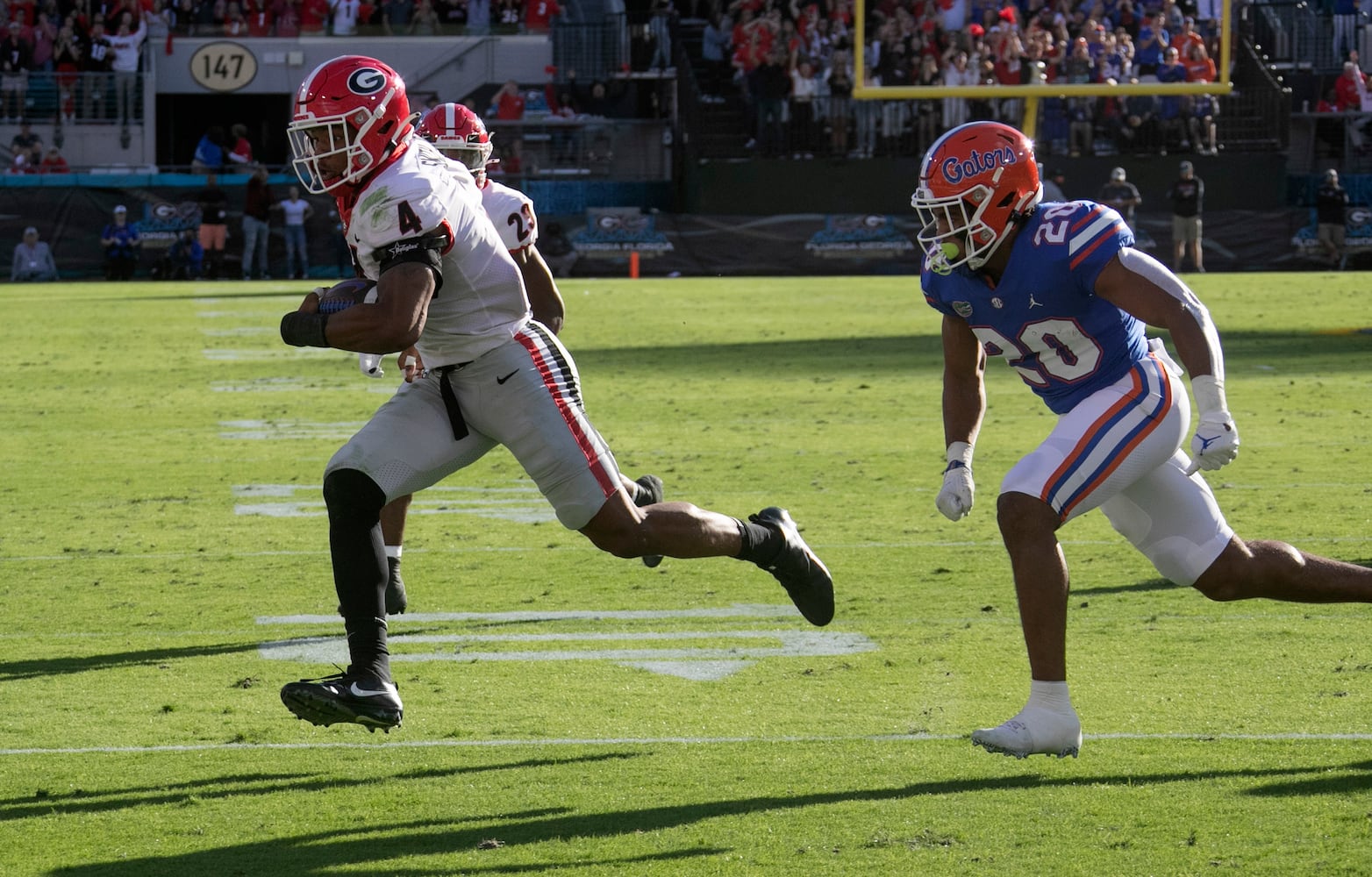 10/30/21 - Jacksonville -  Georgia Bulldogs linebacker Nolan Smith (4) runs a forced fumble he recovered into the end zone.   He was ruled down and the Bulldogs scored on the next series. during the first half of the annual NCCA  Georgia vs Florida game at TIAA Bank Field in Jacksonville.   Bob Andres / bandres@ajc.com